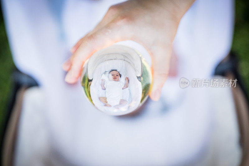 Cute newborn baby in crystal ball